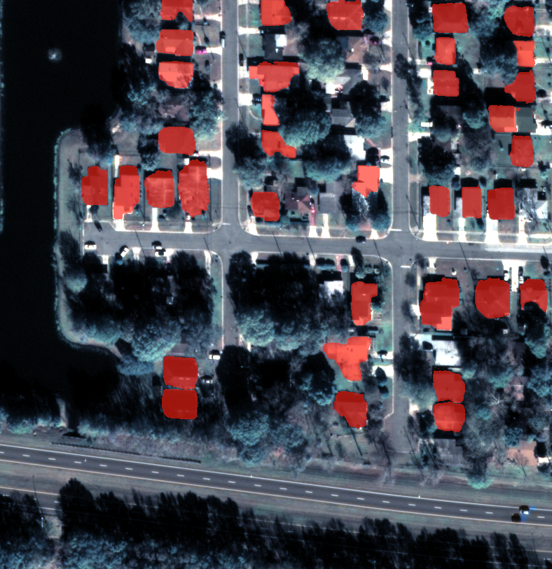 Satellite view of JAX 004 with predicted SAM building masks in red